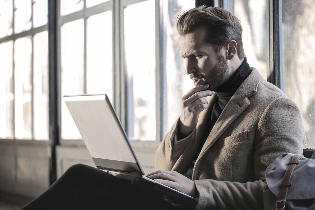 man studying information about prostatitis